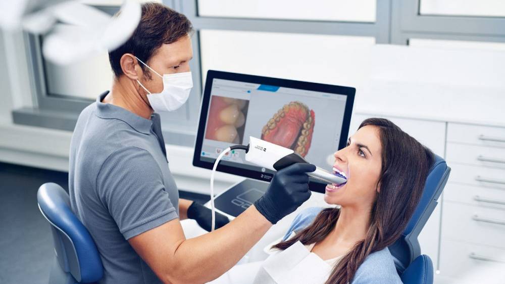cer-product-image-primescan-dentist-scanning-patient-1200×675